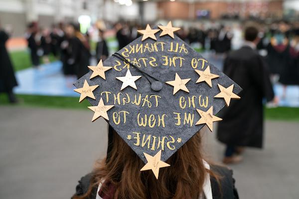 Decorated graduation cap reading "All Thanks to the Stars Who taught me how to Shine"